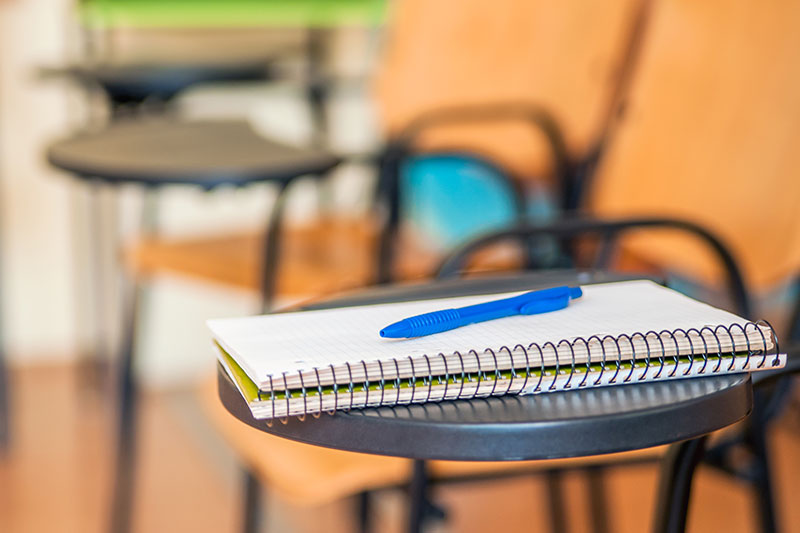 School book on desk, education concept